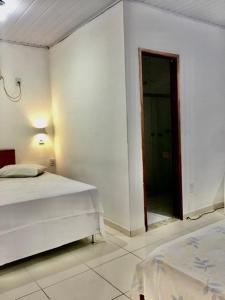 Postel nebo postele na pokoji v ubytování Hotel Pousada Hamburgo