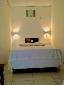 Postel nebo postele na pokoji v ubytování Hotel Pousada Hamburgo