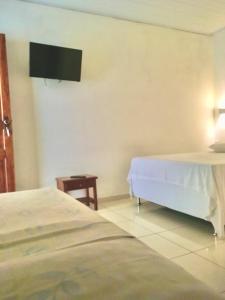 Postel nebo postele na pokoji v ubytování Hotel Pousada Hamburgo