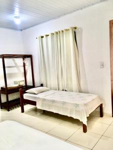 Postel nebo postele na pokoji v ubytování Hotel Pousada Hamburgo