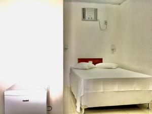 Postel nebo postele na pokoji v ubytování Hotel Pousada Hamburgo