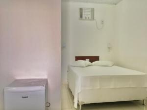 Postel nebo postele na pokoji v ubytování Hotel Pousada Hamburgo