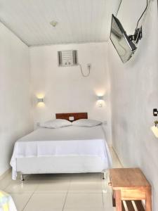 Postel nebo postele na pokoji v ubytování Hotel Pousada Hamburgo