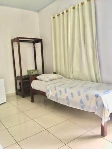 Postel nebo postele na pokoji v ubytování Hotel Pousada Hamburgo