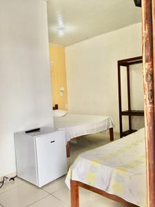Postel nebo postele na pokoji v ubytování Hotel Pousada Hamburgo