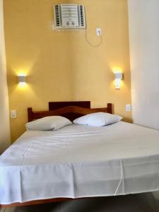 Postel nebo postele na pokoji v ubytování Hotel Pousada Hamburgo