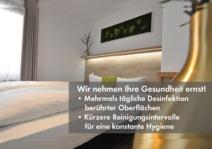 Postel nebo postele na pokoji v ubytování Hotel Perlach Allee by Blattl