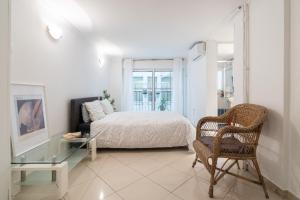a bedroom with a bed and a glass table at Studio in the city center, Syntagma in Athens