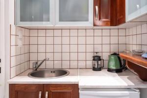 a kitchen with a sink and a counter top at Studio in the city center, Syntagma in Athens +9 photos