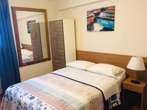 Cama ou camas em um quarto em Hotel Paris Lima