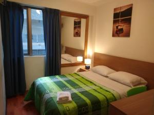 Cama ou camas em um quarto em Hotel Paris Lima