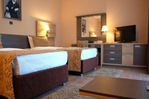 Letto o letti in una camera di Hill Hotel Wellness & Spa