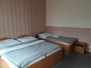 Letto o letti in una camera di Hotel Kralicek