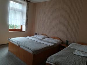 Letto o letti in una camera di Hotel Kralicek