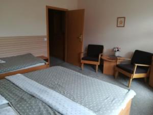 Letto o letti in una camera di Hotel Kralicek