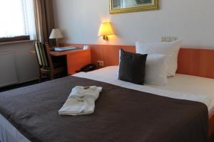 Postel nebo postele na pokoji v ubytování Hotel Pirsch