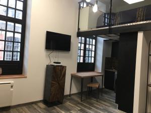 TV a/nebo společenská místnost v ubytování LOFT 8