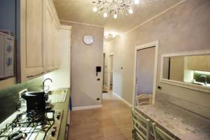 a kitchen with a sink and a stove top oven at ...écche se dòrme in Castelvecchio Subequo