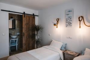 A bed or beds in a room at Villa Boho Ibiza Style