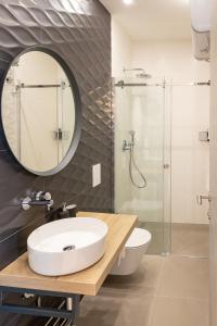 a bathroom with a sink and a shower at Sweet Dreams-Old Town in Split