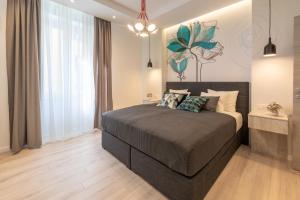 a bedroom with a bed and a large window at Sweet Dreams-Old Town in Split