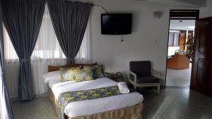 Postel nebo postele na pokoji v ubytování Hotel Mirador Santana