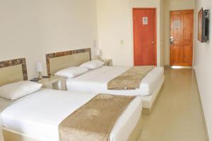 Postel nebo postele na pokoji v ubytování Hotel Cartagena Premium