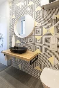 a bathroom with a sink and a mirror on a wall at Sweet Dreams-Old Town in Split