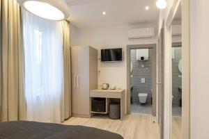 a bedroom with a bed and a bathroom with a shower at Sweet Dreams-Old Town in Split
