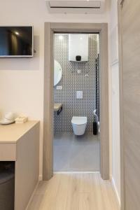 a bathroom with a shower with a toilet and a sink at Sweet Dreams-Old Town in Split