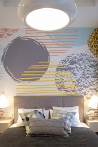 a bedroom with a bed with a large mural on the wall at Sweet Dreams-Old Town in Split