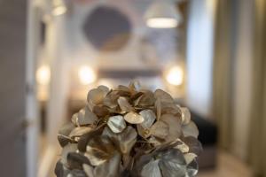 a bouquet of flowers in a vase on a table at Sweet Dreams-Old Town in Split
