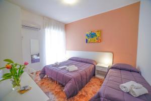 Postel nebo postele na pokoji v ubytování B&B Siracusa Holidays