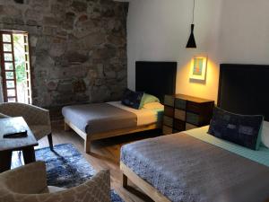 Postel nebo postele na pokoji v ubytování Hotel Real de Piedra