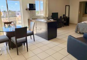TV a/nebo společenská místnost v ubytování Hotel las Margaritas Merida + 1 fotografie