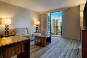 a living room with a couch and a large window at Hyatt Regency Miami in Miami