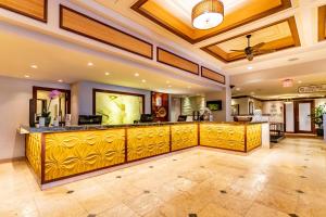 
a large room with a large window and a large counter top at Aston Maui Kaanapali Villas in Lahaina
