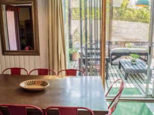 a table with a bowl on top of it on a patio at Casa Campo Lindo in Olmué