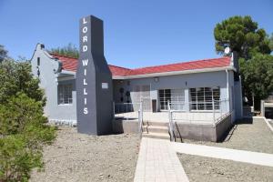 a building with a sign in front of it at LORD WILLIS in Williston