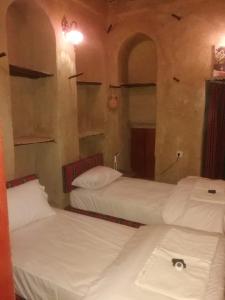 Postelja oz. postelje v sobi nastanitve Al Hamra Old House