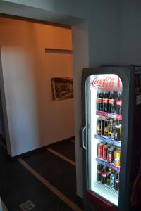 a cocacola soda refrigerator in a room at Art Hotel in Pykhtino