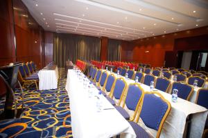 a row of tables and chairs in a conference room at Daamat Hotel in Addis Ababa