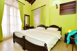 Letto o letti in una camera di Expeditor Kandy