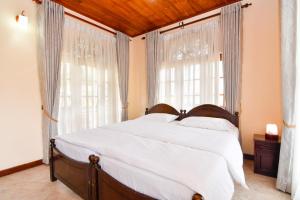 Letto o letti in una camera di Expeditor Kandy