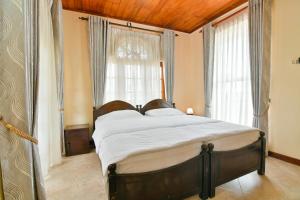 Letto o letti in una camera di Expeditor Kandy