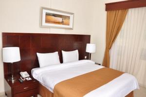 Postel nebo postele na pokoji v ubytování Akas-Inn Hotel Apartment