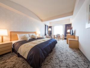 Postel nebo postele na pokoji v ubytování President Hotel Mito