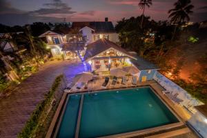 an aerial view of a house with a swimming pool at Blue Elephant Boutique Hotel in Negombo