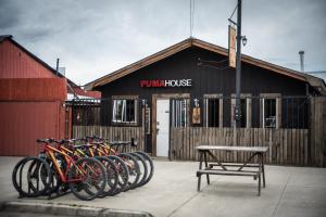 a group of bikes parked in front of a building at Puma House in Puerto Natales