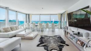 a living room with a zebra rug on the floor at The Hype Beachhouse in Playa de Palma